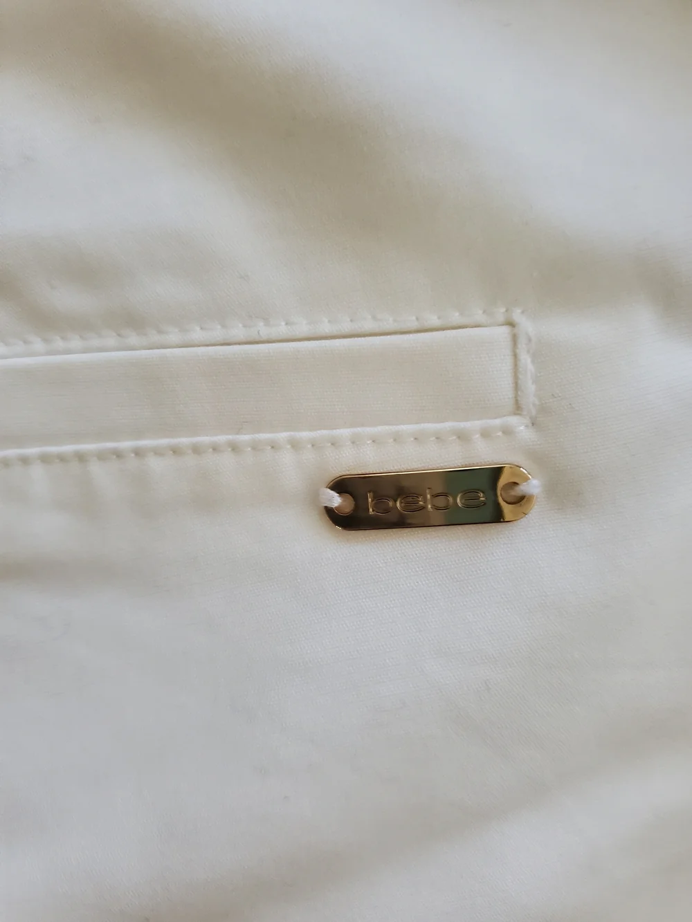 bebe White High-Waist Zip Pocket Shorts